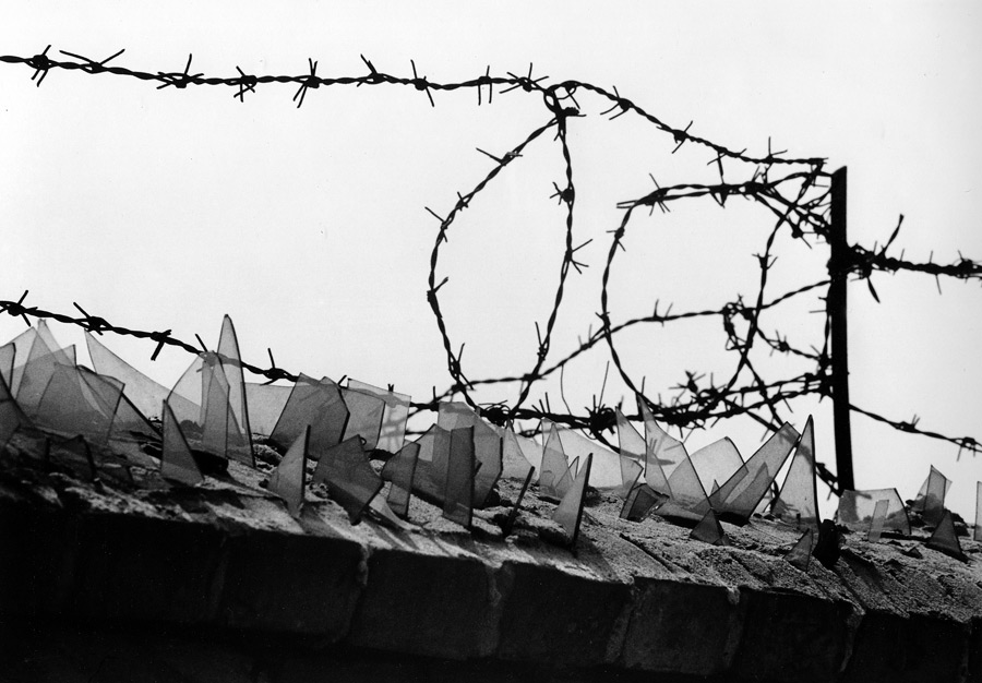 Glass and barbed wire at top of the Berlin Wall, 1962