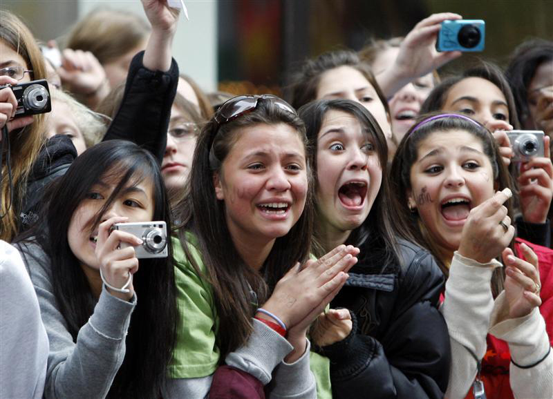 Fans of singer Justin Bieber scream as he performs on NBC's Today Show in New York