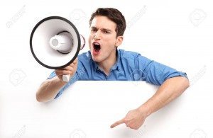 17604590-Guy-with-megaphone-and-white-board-Stock-Photo-megaphone-man-pointing