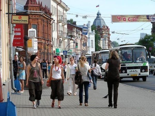 A street, somewhere in the former Soviet Union. Notice the look of the girl in blue, on the left