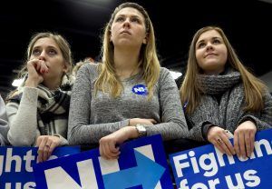 Young women listen to Democratic presidential candidate Hillary Clinton as she speaks at a "Get Out the Vote" event at Great Bay Community College in Portsmouth, N.H., Saturday Feb. 6, 2016. (AP Photo/Jacquelyn Martin)