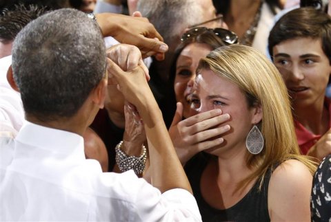 a-woman-cries-while-meeting-us-president-barack-obama-at-the-coral-reef-high-school-in-miami-florida-march-7-2014-reutersyuri-gripas