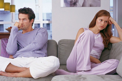 bored-couple-sitting-on-sofa-not-looking-at-each-other