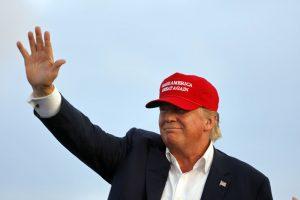 San Pedro, CA, September 15, 2015, Donald Trump, 2016 Republican Presidential Candidate, Waves During A Rally Aboard The Battleship USS Iowa In San Pedro, Los Angeles, California While Wearing A Red Baseball Hat That Says Campaign Slogan 'Make America Great Again.'. (Photo by: Visions of America/UIG via Getty Images)